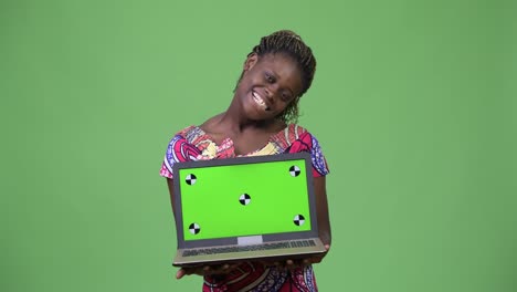 Young-African-woman-showing-laptop