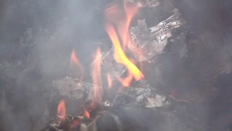 Fire-slow-motion-burning-on-garbage-pile-to-air-pollution