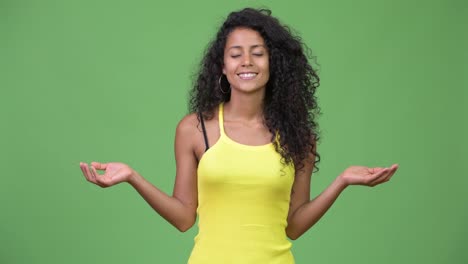 Young-happy-beautiful-Hispanic-woman-relaxing-with-eyes-closed