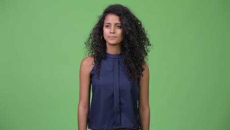 Young-beautiful-Hispanic-businesswoman-with-curly-hair