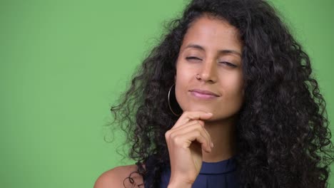 Young-happy-beautiful-Hispanic-businesswoman-thinking