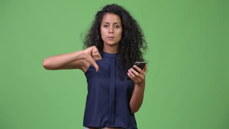 Young-beautiful-Hispanic-businesswoman-using-phone