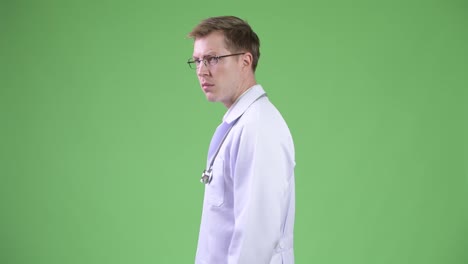 Back-View-Of-Young-Man-Doctor-Turning