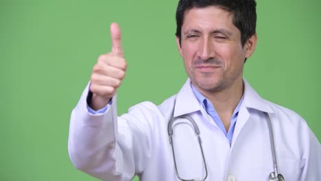 Happy-Hispanic-man-doctor-giving-thumbs-up