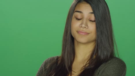 Young-woman-with-attitude,-on-a-green-screen-studio-background