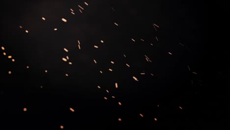 flying-sparks-of-fire-with-smoke,-abstract-animation-of-flying-particles-with-motion-blur