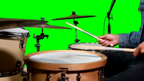 Mid-section-of-drummer-playing-drum