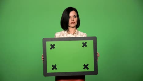 Young-female-holding-chromakey-board