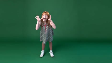 Cute-little-ginger-girl-playing--the-ape-and-fooling-around