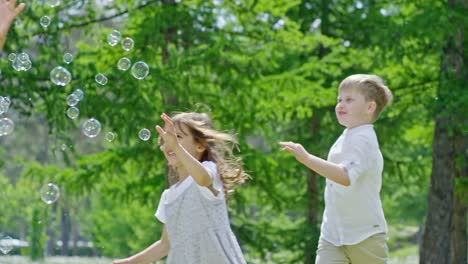 Multi-Ethnic-Group-of-Kids-Playing-with-Soap-Bubbles-Outdoors