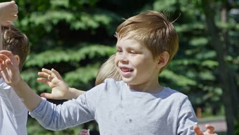 Lovely-Little-Boys-Bursting-Soap-Bubbles-Outdoors