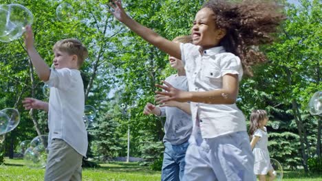 Cheerful-Kids-Chasing-Soap-Bubbles