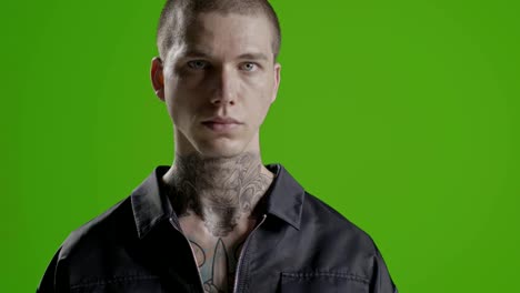 Handsome-confident,-successful-stylish-man-portrait---neck-tattoo---male-fashion-model-greenscreen---Prores