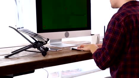 Young-Caucasian-Programmer-Working-on-a-Computer-at-His-Home-Office