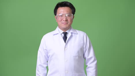 Mature-Japanese-man-doctor-wearing-protective-glasses