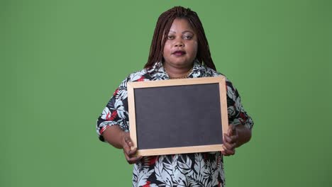 Overweight-beautiful-African-woman-against-green-background