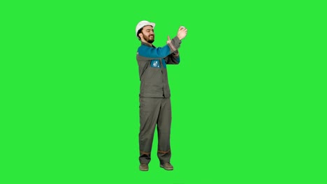 Smiling-man-in-helmet-make-selfie-on-a-Green-Screen,-Chroma-Key