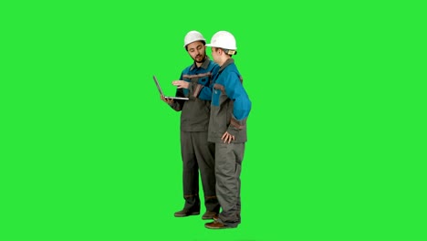 Supervisors-using-laptop-at-construction-site-on-a-Green-Screen,-Chroma-Key
