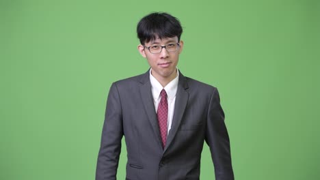 Young-Asian-businessman-with-stop-gesture