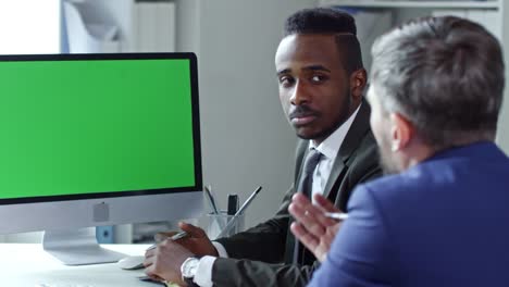 Business-Partners-Web-Conferencing-on-Computer-with-Chroma-Key-Screen