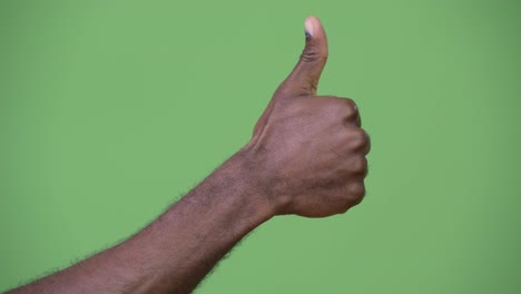 Hand-of-young-African-man-giving-thumbs-up