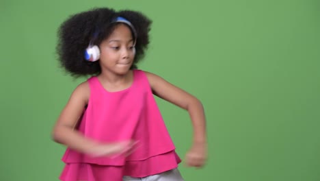 Young-cute-African-girl-with-Afro-hair-listening-to-music