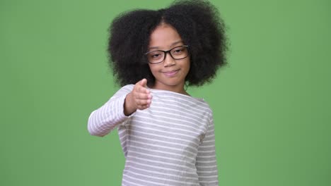 Young-cute-African-girl-with-Afro-hair-giving-h-andshake