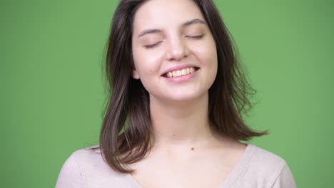 Young-happy-beautiful-woman-relaxing-with-eyes-closed