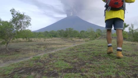 Man-Hiking-in-Bali-near-Erupting-Volcano