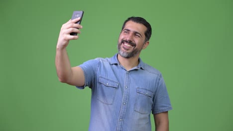 Handsome-Persian-bearded-man-taking-selfie