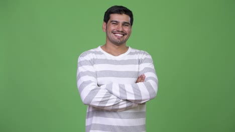 Young-handsome-Persian-man-with-arms-crossed