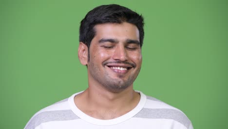 Young-handsome-Persian-man-relaxing-with-eyes-closed