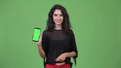 Young-beautiful-woman-showing-phone