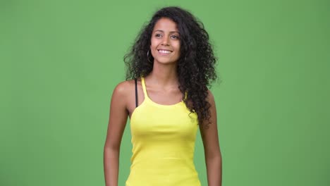 Young-happy-beautiful-Hispanic-woman-with-curly-hair