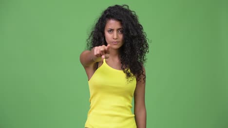 Young-angry-Hispanic-woman-pointing-at-camera