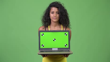 Young-beautiful-Hispanic-woman-showing-laptop