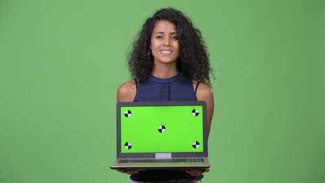 Young-beautiful-Hispanic-businesswoman-showing-laptop