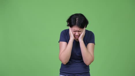 Stressed-woman-covering-ears-from-loud-noise