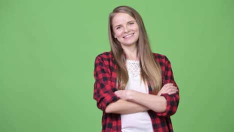 Young-beautiful-hipster-woman-smiling-with-arms-crossed