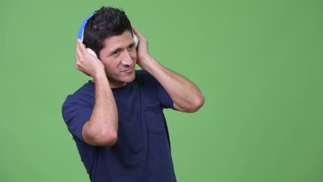 Hispanic-man-listening-to-music