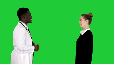 Acquaintance-doctor-with-a-patient-on-a-Green-Screen,-Chroma-Key