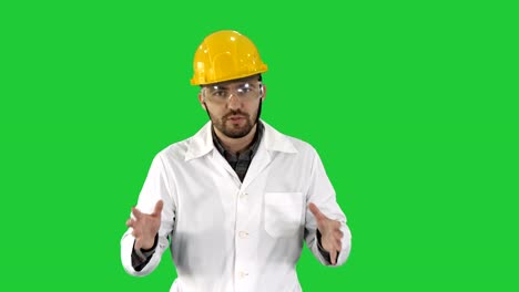 Confident-Engineer-Man-Talking-Camera-on-a-Green-Screen,-Chroma-Key