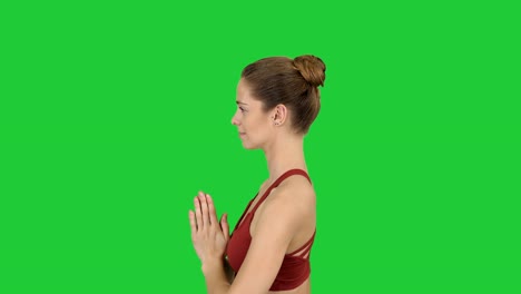 Young-woman-practicing-yoga-on-a-Green-Screen,-Chroma-Key
