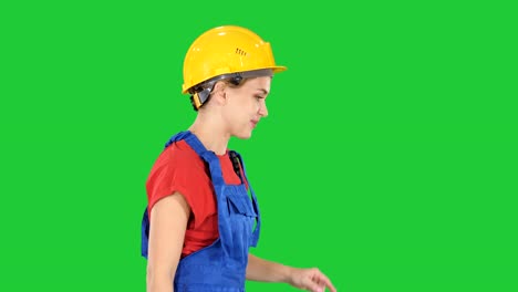 Female-construction-worker-dancing-happy-on-a-Green-Screen,-Chroma-Key