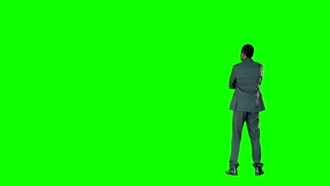 Businessman-pointing-on-a-green-screen