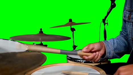 Mid-section-of-drummer-playing-drum