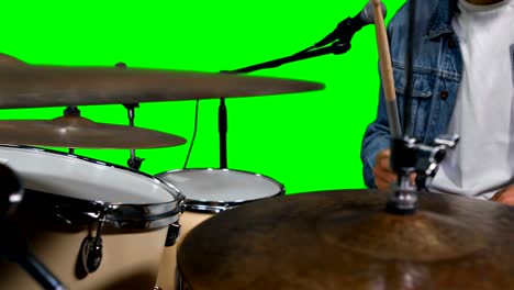 Mid-section-of-drummer-playing-drum