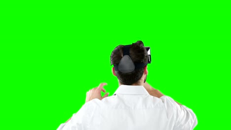 Rear-view-of-man-using-virtual-reality-headset