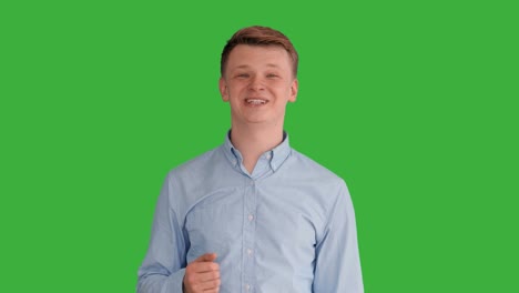 Young-Handsome-Men-Acting-in-Front-of-a-Green-Screen.-Blond-Hair,-Blue-Shirt-and-Blue-Trousers.-Dancing,-Thinking,-Turning-Around-and-Talking-to-the-Camera.