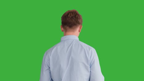 Young-Handsome-Men-Acting-in-Front-of-a-Green-Screen.-Blond-Hair,-Blue-Shirt-and-Blue-Trousers.-Dancing,-Thinking,-Turning-Around-and-Talking-to-the-Camera.